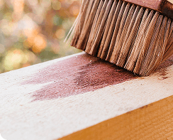 handsome-man-carrying-wood-planks