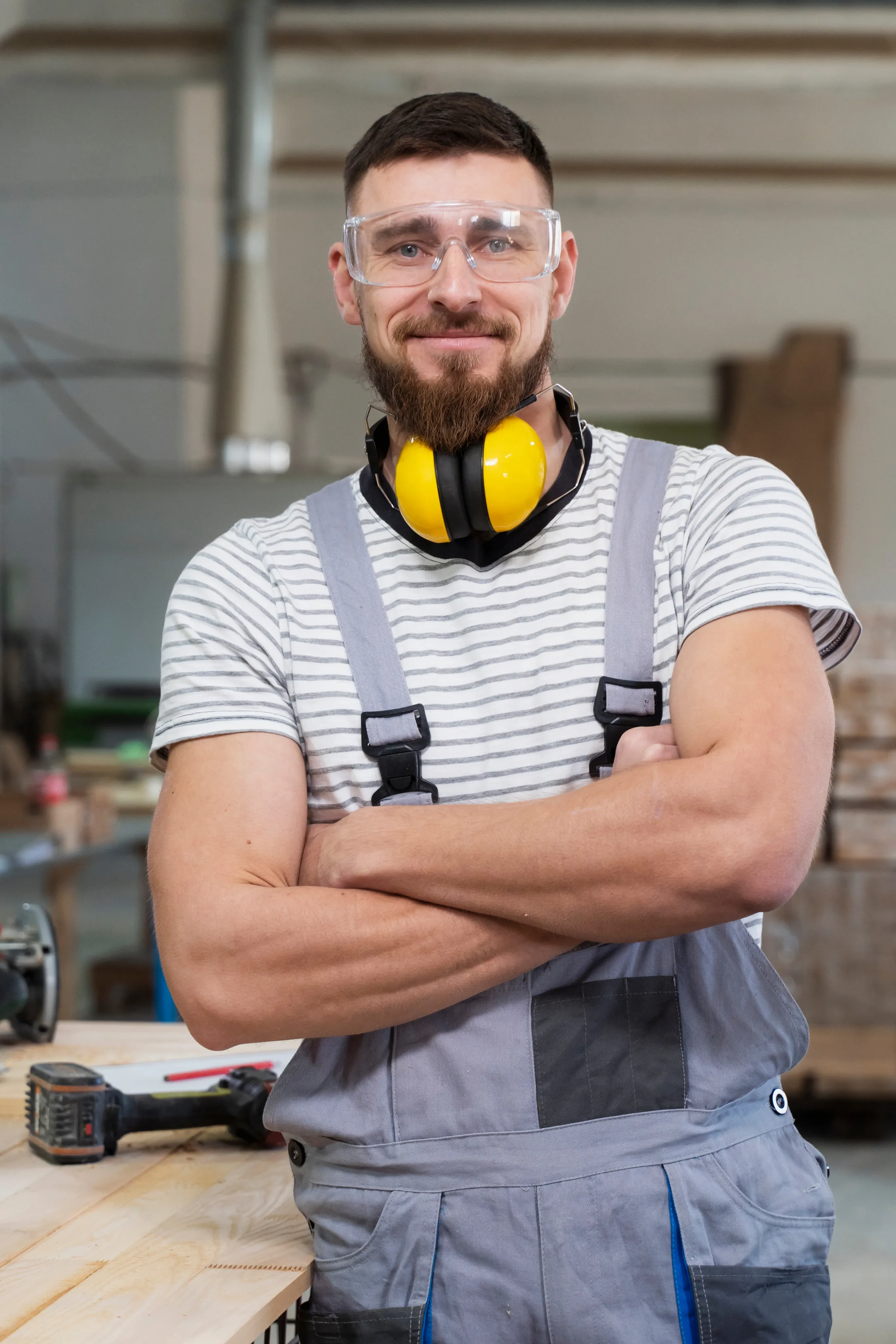 Worker with protective glasses